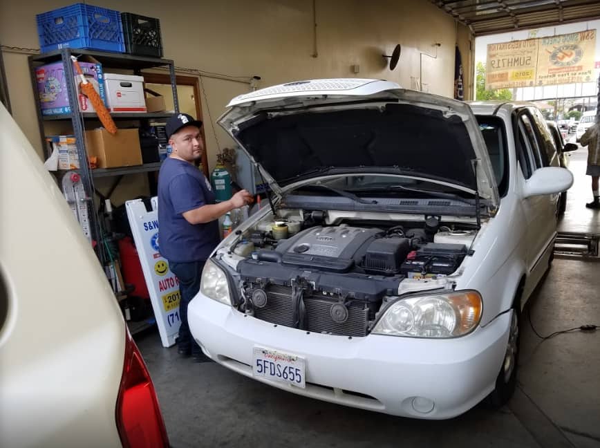 Cars queued at the S and W Automotive Smog Check station